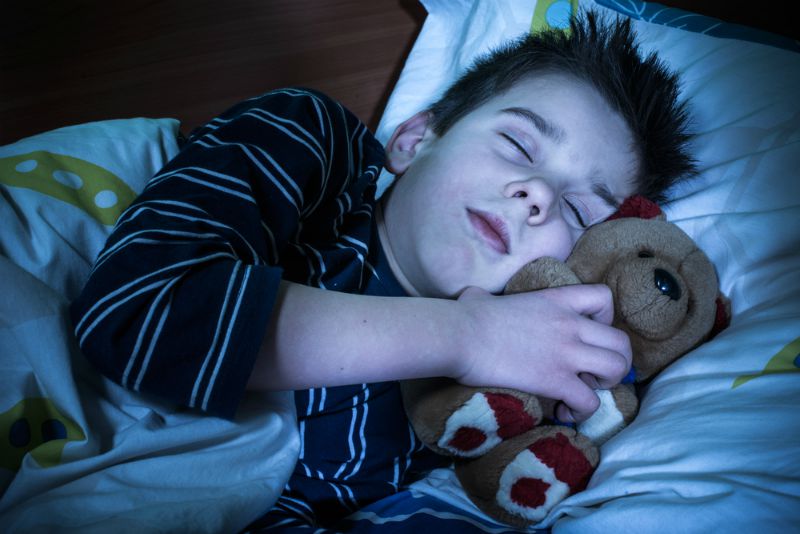 Child sleeping in bed